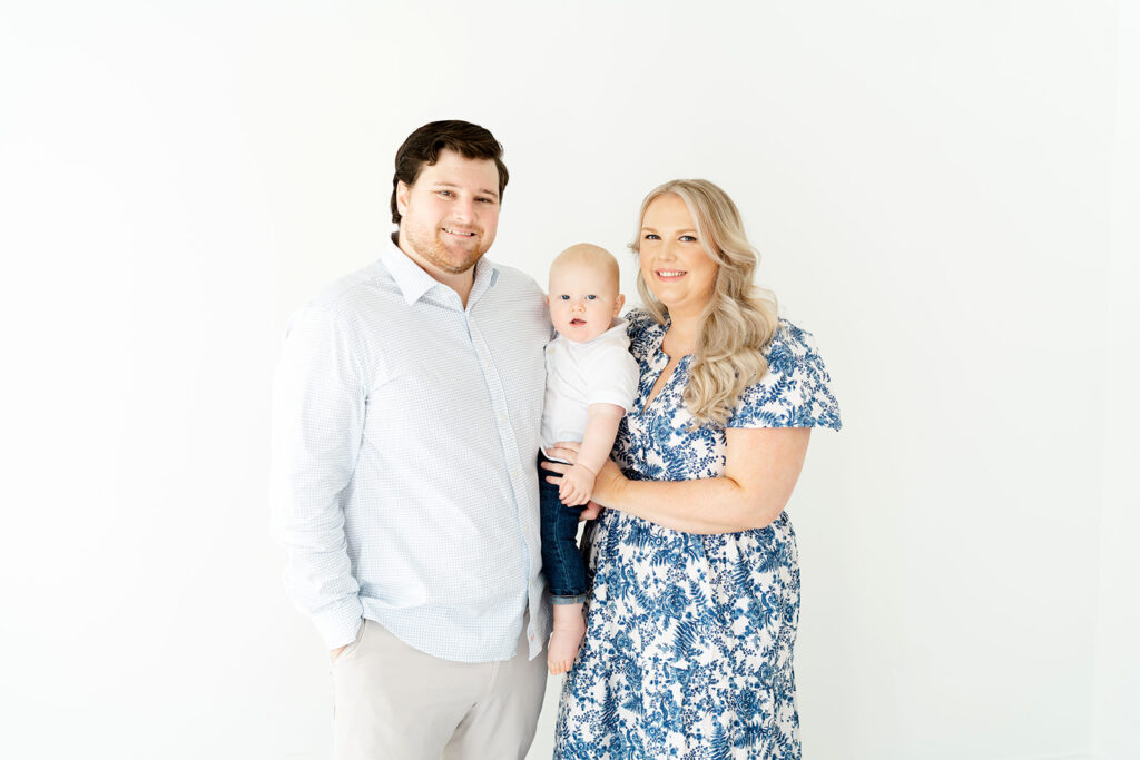 Family of 3 at baby milestone session in Marietta, GA studio by Lindsey Powell Photography