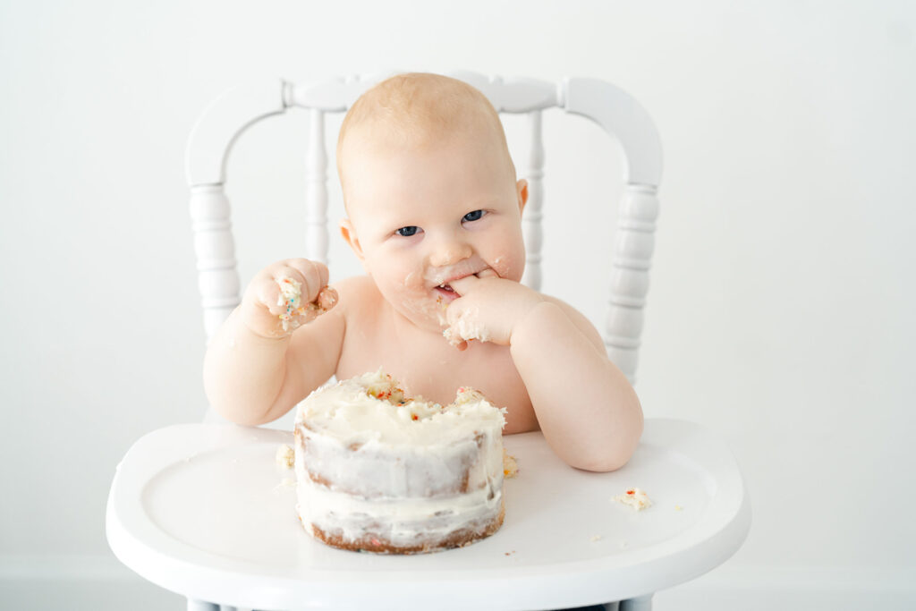 Baby in high chair for cake smash at  Atlanta First Birthday Photo Session in Marietta Studio